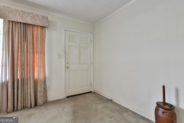 spare room with crown molding, baseboards, and light carpet