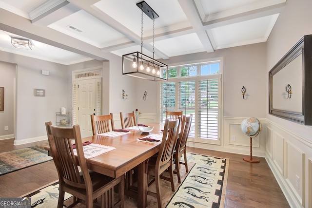 dining area featuring visible vents, coffered ceiling, light wood finished floors, and beam ceiling