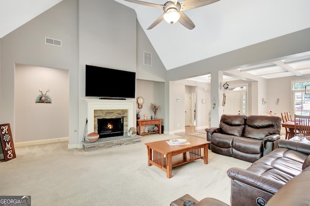 living area with a fireplace, carpet, a ceiling fan, and visible vents