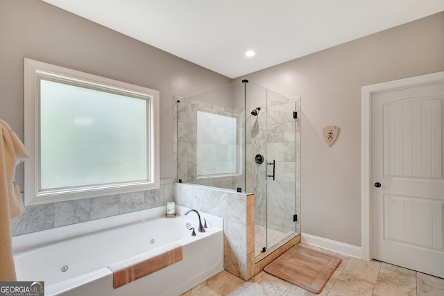 full bath with a whirlpool tub, baseboards, and a stall shower