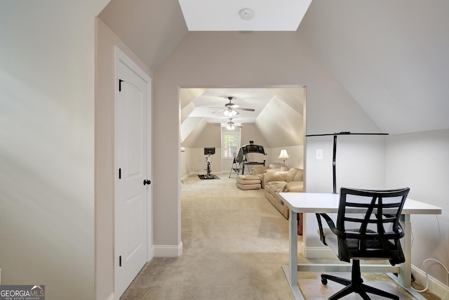 office area with ceiling fan, light colored carpet, and lofted ceiling