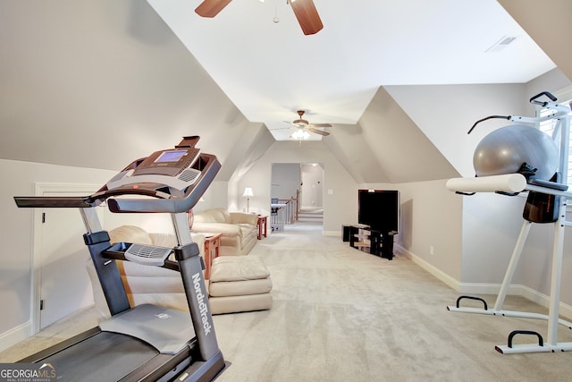 exercise room with carpet flooring, ceiling fan, vaulted ceiling, and baseboards