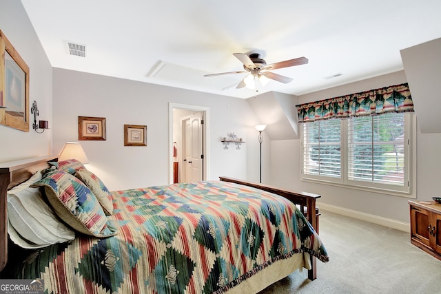 bedroom featuring baseboards, light carpet, a ceiling fan, and visible vents