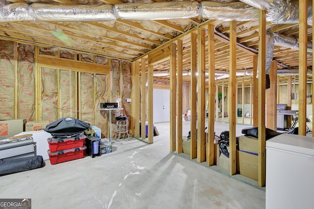 misc room featuring unfinished concrete flooring