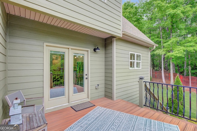 wooden terrace with french doors and fence