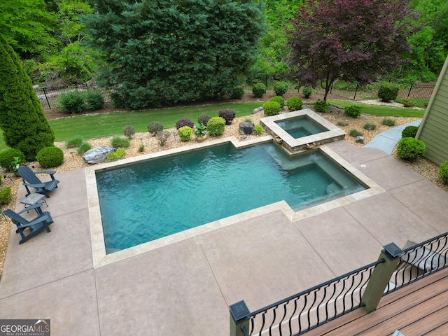 view of swimming pool featuring an in ground hot tub, a patio area, fence, a fenced in pool, and a yard