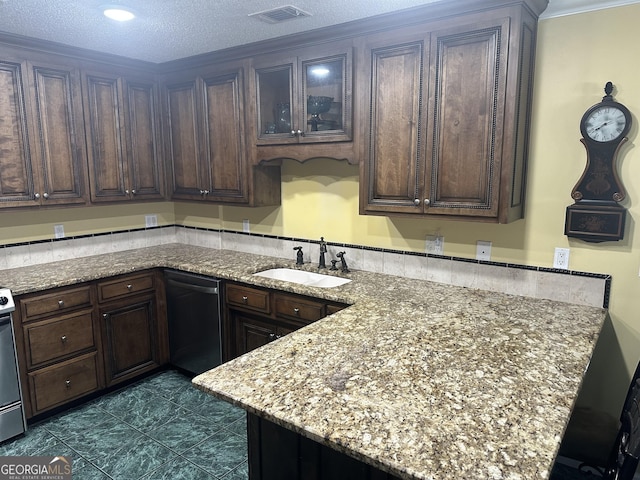 kitchen featuring light stone countertops, visible vents, a sink, and dishwasher