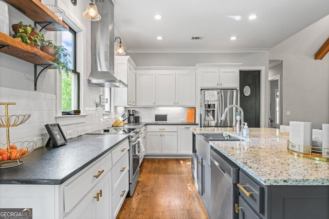 kitchen with visible vents, open shelves, white cabinetry, a sink, and stainless steel appliances
