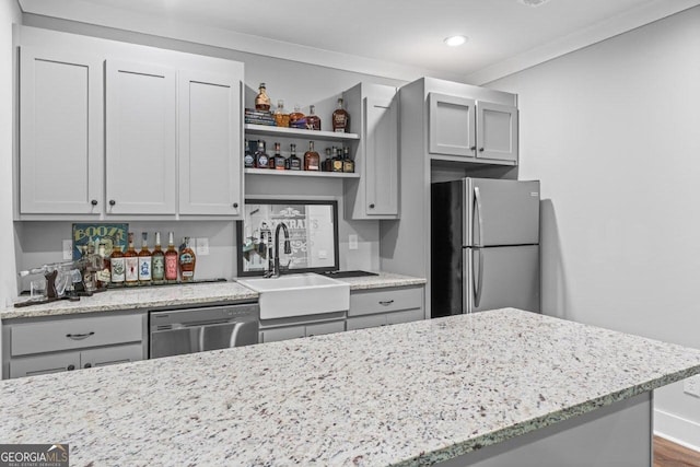 kitchen featuring stainless steel appliances, open shelves, recessed lighting, and light stone countertops
