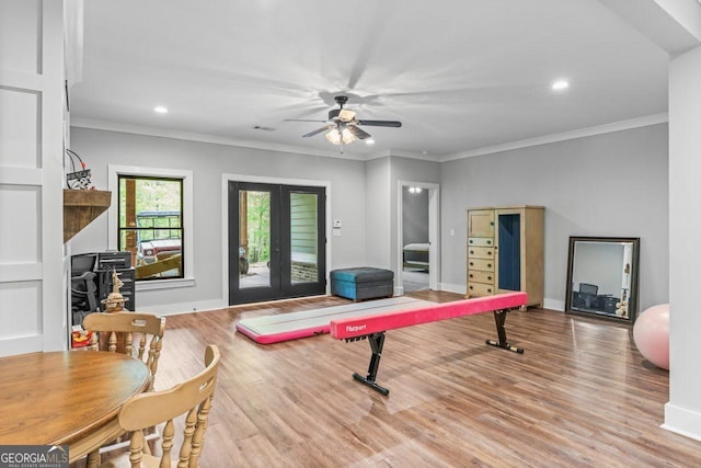 interior space featuring ceiling fan, french doors, crown molding, wood finished floors, and recessed lighting