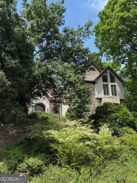 view of side of property featuring stucco siding