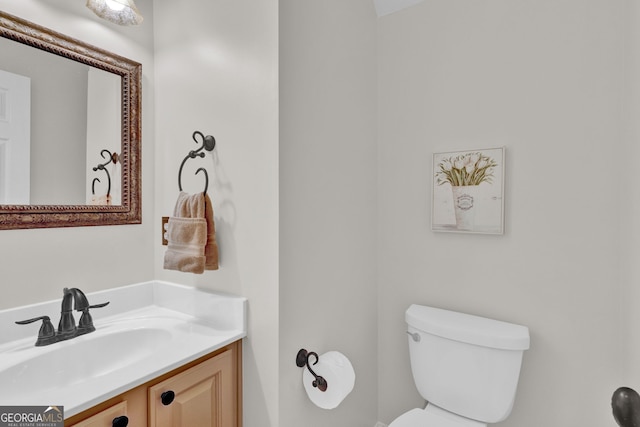 bathroom with vanity and toilet