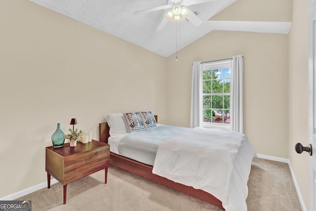 carpeted bedroom with vaulted ceiling, baseboards, and a ceiling fan