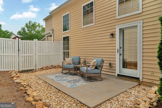 view of patio / terrace featuring a gate and fence