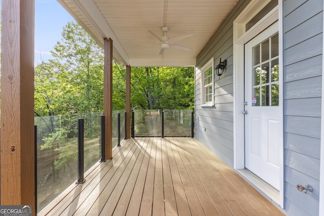wooden deck featuring ceiling fan and covered porch