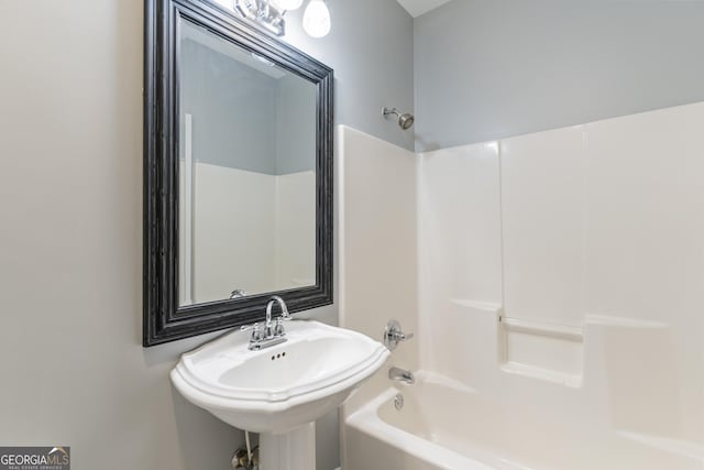 bathroom featuring a sink and  shower combination