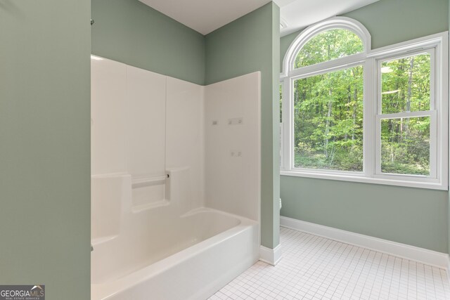 full bathroom with baseboards, shower / tub combination, tile patterned floors, and a healthy amount of sunlight