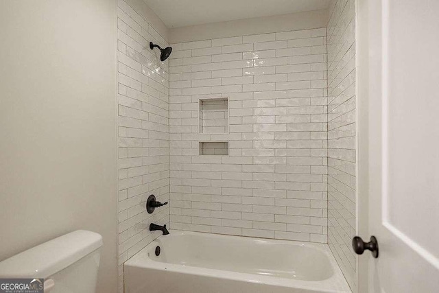 full bathroom with washtub / shower combination and toilet