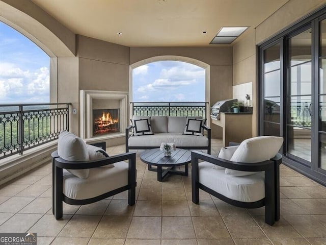 exterior space featuring an outdoor living space with a fireplace