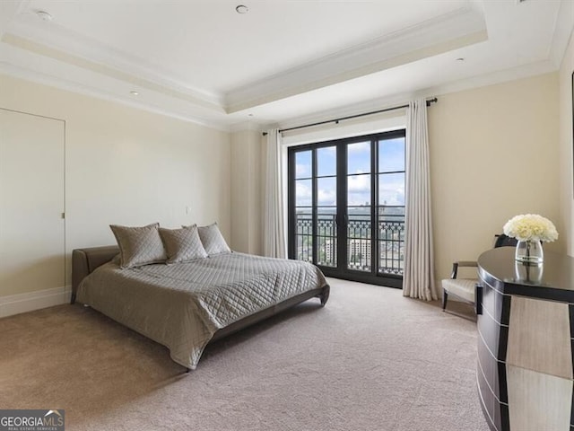 bedroom with crown molding, access to outside, carpet, and a raised ceiling