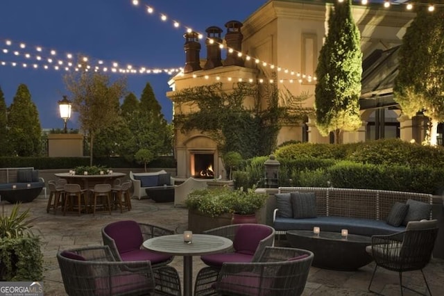 view of patio / terrace featuring an outdoor living space with a fireplace