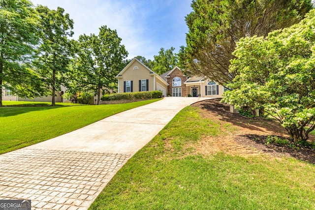 traditional-style home with concrete driveway and a front yard
