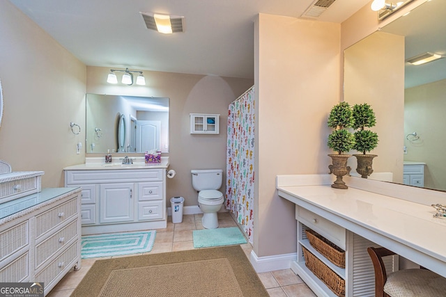 bathroom with tile patterned floors, vanity, toilet, baseboards, and a shower with curtain