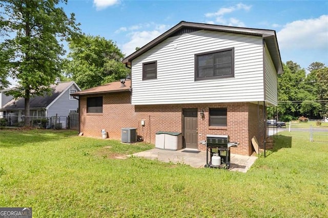 2469 Silver King Dr, Grayson, GA 30017 - back of property featuring a lawn, brick siding, and fence