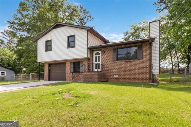 2469 Silver King Dr, Grayson, GA 30017 - tri-level home with brick siding, fence, a front lawn, concrete driveway, and an attached garage