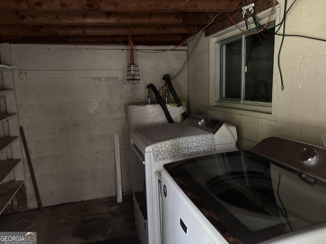 laundry room featuring washing machine and clothes dryer and laundry area