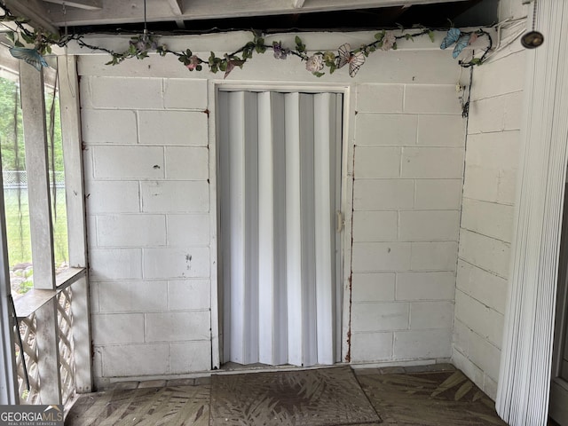 interior space featuring concrete block wall