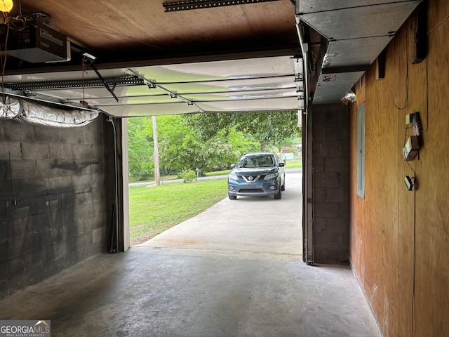 garage featuring concrete block wall