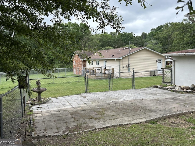 view of patio / terrace with fence and a gate