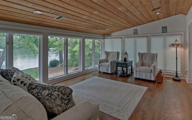 interior space featuring visible vents, wood ceiling, lofted ceiling, and wood finished floors
