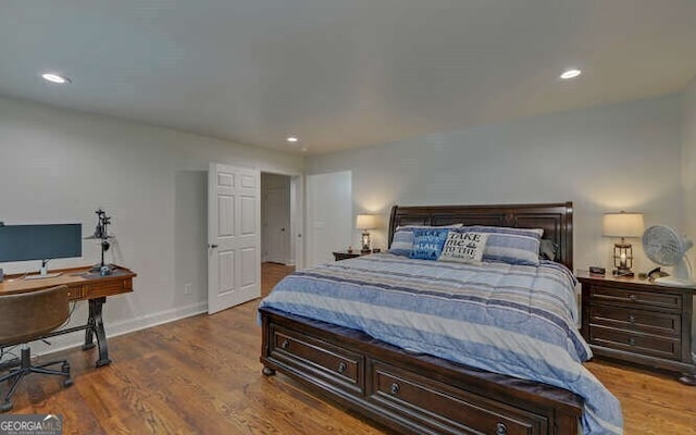 bedroom with baseboards, recessed lighting, and wood finished floors