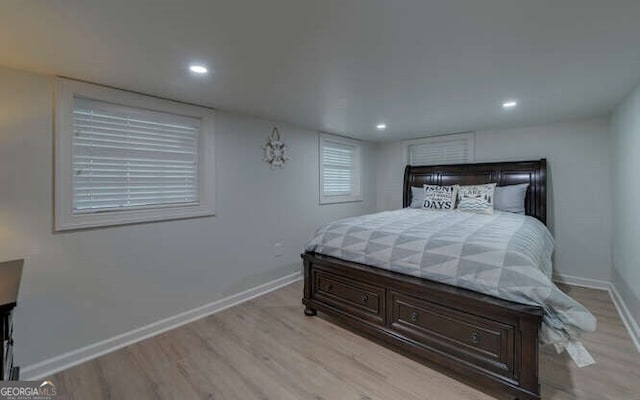 bedroom featuring recessed lighting, baseboards, and light wood-style floors