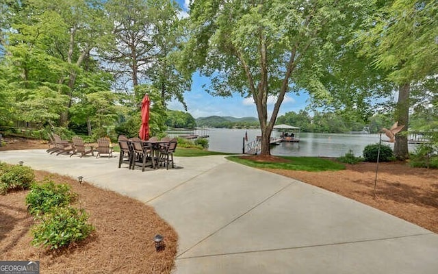 view of patio featuring a water view