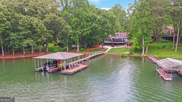 dock area featuring boat lift and a water view