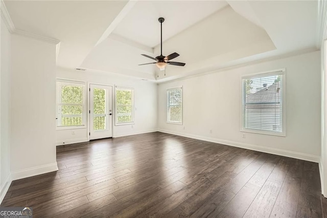 632 Warren Ave, Scottdale, GA 30079 - spare room featuring baseboards, a ceiling fan, a raised ceiling, and dark wood-style floors