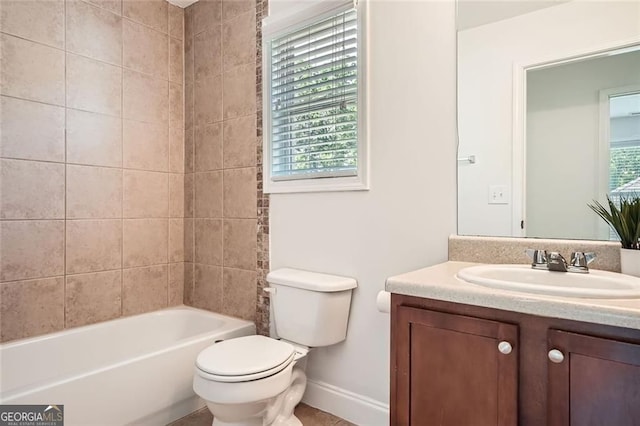 632 Warren Ave, Scottdale, GA 30079 - bathroom featuring vanity, toilet, baseboards, and plenty of natural light