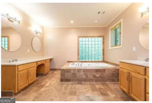 5325 Pheasant Run, Stone Mountain, GA 30087 - bathroom with visible vents, a sink, a bath, and two vanities