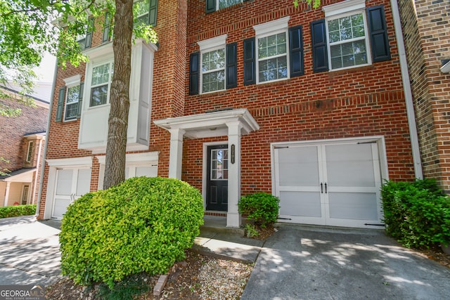 2201 Landing Walk Dr, Duluth, GA 30097 - view of front of home featuring an attached garage, concrete driveway, and brick siding