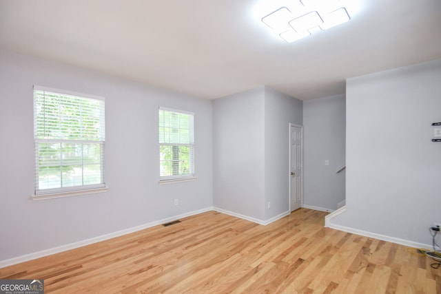 2201 Landing Walk Dr, Duluth, GA 30097 - unfurnished room featuring baseboards, visible vents, and light wood-type flooring