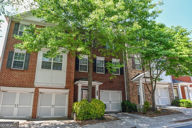 2201 Landing Walk Dr, Duluth, GA 30097 - townhome / multi-family property featuring brick siding and an attached garage