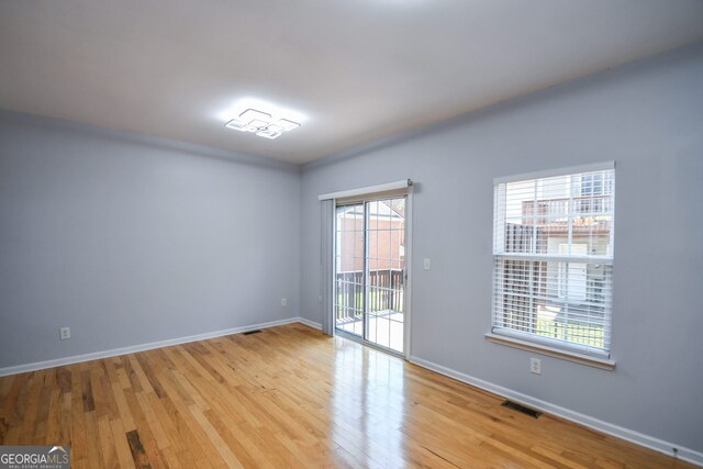 2201 Landing Walk Dr, Duluth, GA 30097 - unfurnished room featuring light wood-style floors, baseboards, and visible vents