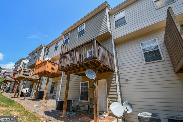 2201 Landing Walk Dr, Duluth, GA 30097 - rear view of house with a wooden deck and central AC