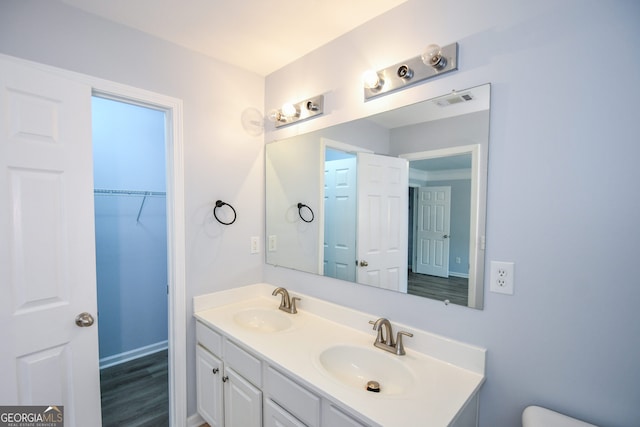 2201 Landing Walk Dr, Duluth, GA 30097 - bathroom with double vanity, toilet, visible vents, and a sink