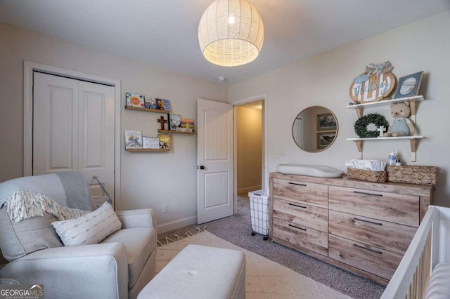 interior space with baseboards and a closet