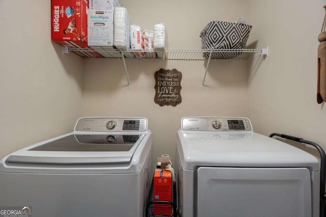 washroom with laundry area and independent washer and dryer