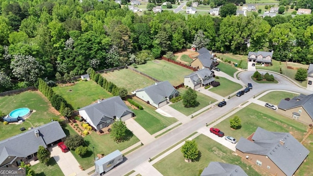 birds eye view of property with a residential view